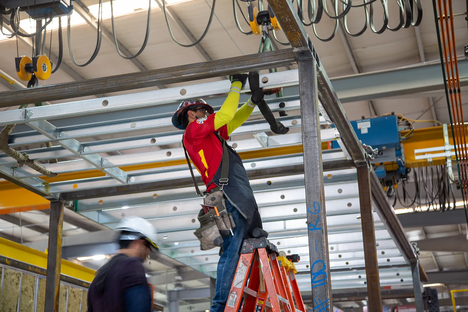 Crew working on an overhead steel frame